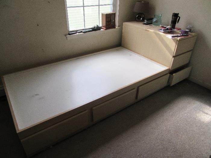 teen twin size bed platform with build-in storage plus adjoining drawers.