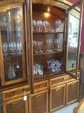 Large china cabinet has matching dining table and server.