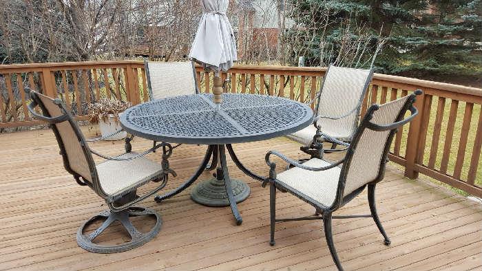 Heavy, durable patio set with four chairs and umbrella  $650