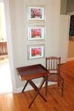 Antique cane chair, folding tray table, and framed photography