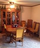 China cabinet and matching chairs. Beveled glass doors, glass shelves and interior lights
