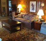 Large, heavy coffe table with storage, hide-a bed in great shape and has great mattress still in plastic. Drum side table with storage on casters and watercolor of European city street