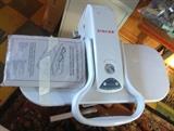 Singer professional press steam iron.  Stands 36" and has different settings.  Like new with original manuals. 
