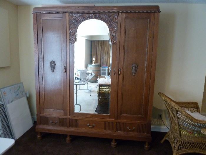 Antique Louis XVI Amoire/Wardrobe with three doors and beveled mirror. Rare find and a beauty! Early nineteen-hundreds French Oak