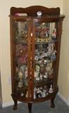Antique Oak Curved Front Curio Cabinet with Glass Figurines