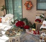 Round Glass Top Rattan Coffee Table and Christmas Decorations