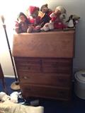 secretary table with dresser, stuffed animals