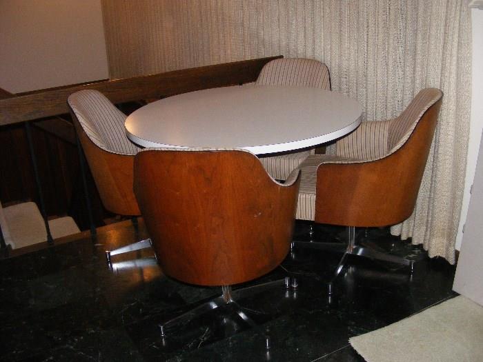Mid Century Dinette with Round Table and 4 Bentwood teak back Swivel Chairs. 