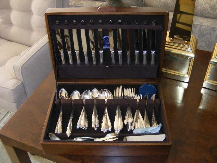 Towle Service for 12 Sterling includes: 12 each of knives, forks, salad forks, cream soups, ice tea spoons, seafood forks, butter knives, 20 teaspoons, 3 serving spoons, cold meat fork, gravy ladle, master butter, pie server. 