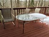 #41 Glass patio table with 4 chairs $175
