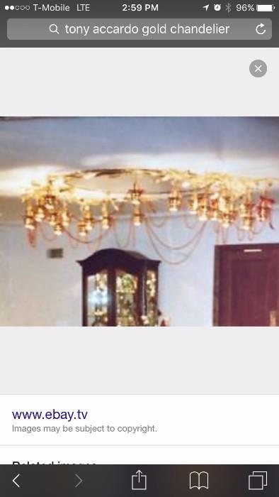 image from the Accardo Mansion on Google showing chandelier and the cabinet in this sale