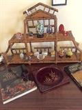 Bamboo and rattan shelf from Gump's - San Francisco.  Collection of Cloisonné and carved eggs.