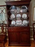 2-Piece, lighted Henkel Harris china cabinet, with pacific cloth lined silverware drawer and double door storage beneath.