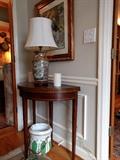 Nicely inlaid mahogany demi-lune game table, with English porcelain porta-potty beneath. Nice Asian lamp, with deflowered shade.