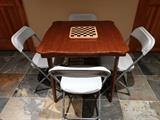 Nice mahogany folding card table, w/4 dopey plastic chairs. 