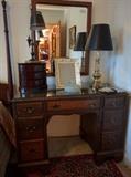 Obligatory mahogany dresser (has a matching chair) with jewelry chest, vintage glass powder jar, basic brass table lamp, Italian tole lamp, God awful picture frame. 