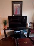 Mee maw needs to watch her programs, so here's a very nice flat screen TV, w/stand.