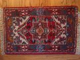 Tiny Persian Heriz rug, 100% wool, hand woven, measures 1' 6" x 2' 4".