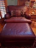 Cool-as-a-cucumber leather armchair/ottoman, one of a pair.
