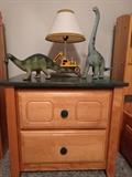 Side table, with dinosaurs. No, they aren't real.