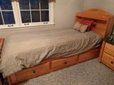 One of a pair of twin beds, with storage underneath. 
