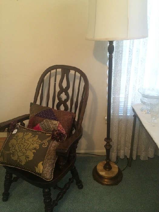 Windsor style chair; decorative pillows; floor lamp