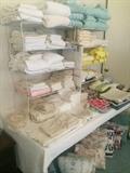 Many linens, towels, and pillows