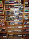 100's of Hard bound and paperback books. There is Sci-fi, Mystery novels, Coffee table books, Innformational books. Also book cases