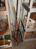 pots, pans, shelving unit, fishing poles, advertising wood box, micellaneous