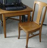 Square oak game table with round, padded insert.  Oak T-back chair.  (Computer is not included in the sale.)