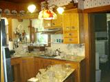 Lots of vintage glass, kerosene lamps (large and small, not pictured), and general line of kitchen gadgets.