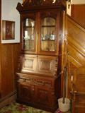 American Victorian drop-front secretary / bookcase in walnut.
Buggy whips and walking sticks or canes to the right.
