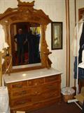 American Victorian marble-top chest with candle shelves.