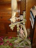 Upright spinning wheel for flax or wool.