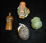 2 netsukes, a small bell and a wooden monk