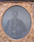 Several cased images. Among them, this double-armed Union cavalry soldier with rare Whitney revolver.
