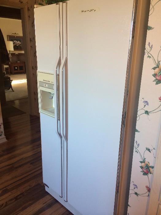 The KitchenAid refrigerator has door water dispenser.