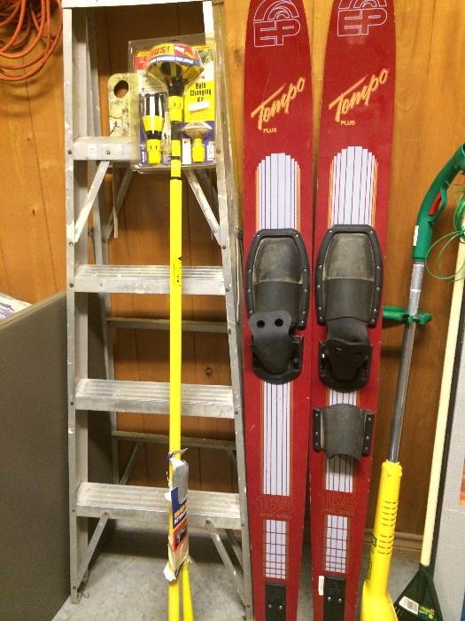 Skis; ladder; yard tools