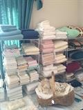 Many towels, sheets, and other linens