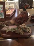 Porcelain bird on wooden stand