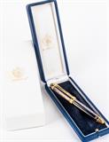 Lot #1, Fabergé Michel Perchin Imperial Blue Fountain Pen
A stunning limited edition Fabergé, Michel Perchin, Imperial Russian fountain pen. The fabulous pen has an enameled royal blue barrel, 22kt gold washed sterling bands and a two tone 18kt nib embellished with the Michel Perchin elephant emblem. The heirloom quality pen has several markings on the cap including the year of production, "1995", on the top. The ring around the bottom of the cap reads, "Michel Perchin 1633 / 4321 - 925 - Germany". Comes in a leather covered presentation case with original care and instruction information, a box of ink refill cartridges, and outer cardboard package which is incised with the Fabergé double eagle emblem. In pristine condition. Measures about 5.5" long. See another Fabergé pen in lot # 148. Tag Words: Gift, graduation, birthday, guilloche, Faberge