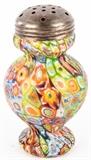 Lot #197, Rare Italian Murano Millefiori Glass Sugar Shaker
Vintage Murano Italy Millefiori Glass Sugar Shaker. Beautiful and rare item. In great condition. Very desirable and difficult to find. Silverplate threaded twist on and off lid or stopper. Measures 5" tall by 3" at the widest point. Hand blown glass.(manufactured Fratelli Toso, Venice, Italy circa 1920-1925). This is what is called the MILLEFIORI PATTERN (MURRINE) There are various flowers of multicolored type, spread on glass surface of the round & bulged base of the sugar shaker. The multi colored flowers have the typical Millefiori's distortions that this type of hand blown Venetian glass is famous for. Don't miss out on this. Tag Words: Studio Art Glass, European, Kitchen, Dispenser
