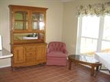 China cabinet, barrel chair and coffee table