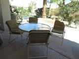 Round patio table, 4 chairs with pads