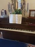 George Steck piano; candelabras; oval mirror;