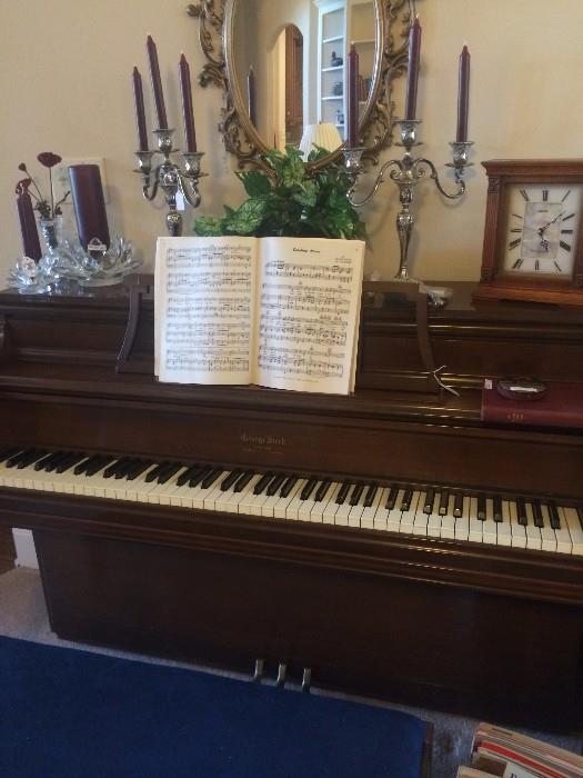 George Steck piano; candelabras; oval mirror;  