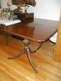 1940s mahogany dining table measures 61" x 40".
