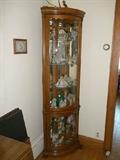 Space saving tall corner curio cabinet (lighted).