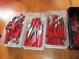 We have wood handled flatware in red and plastic handled flatware in red.