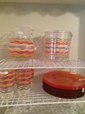 Colorful pitcher, ice bucket, glasses, and plates